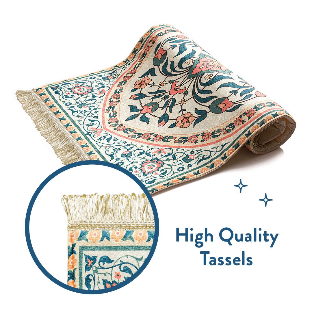 Rolled padded prayer mat in teal and coral floral design with close-up of high-quality tassels.