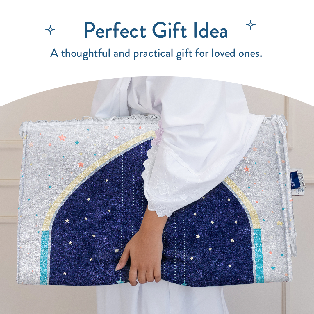 Person holding folded Adult Padded Prayer Mat with Blue Crescent Moon Design from Urban Rugs UK.