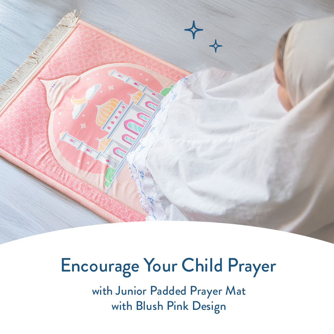Young girl sitting on Junior Padded Prayer Mat with Blush Pink Masjid design by urban rugs uk