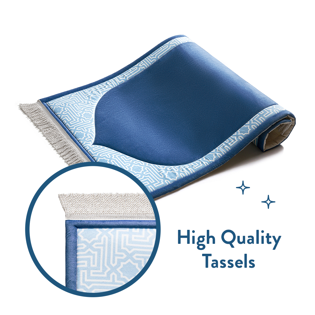 Rolled junior padded prayer mat with close-up of high-quality tassel by urban rugs uk