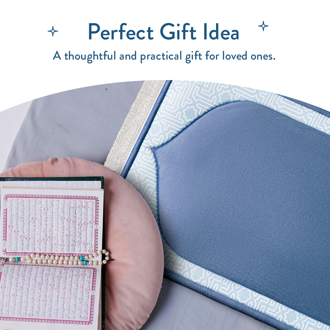 Open Qur’an next to junior padded prayer mat in classic blue design by urban rugs uk