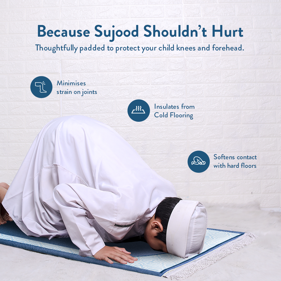 Young boy in prostration on blue junior padded prayer mat by urban rugs uk