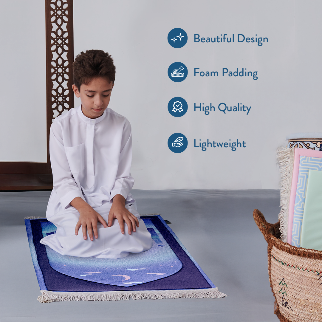 Young boy praying on Padded Kids Prayer Mat with Twilight Masjid Design by urban rugs uk