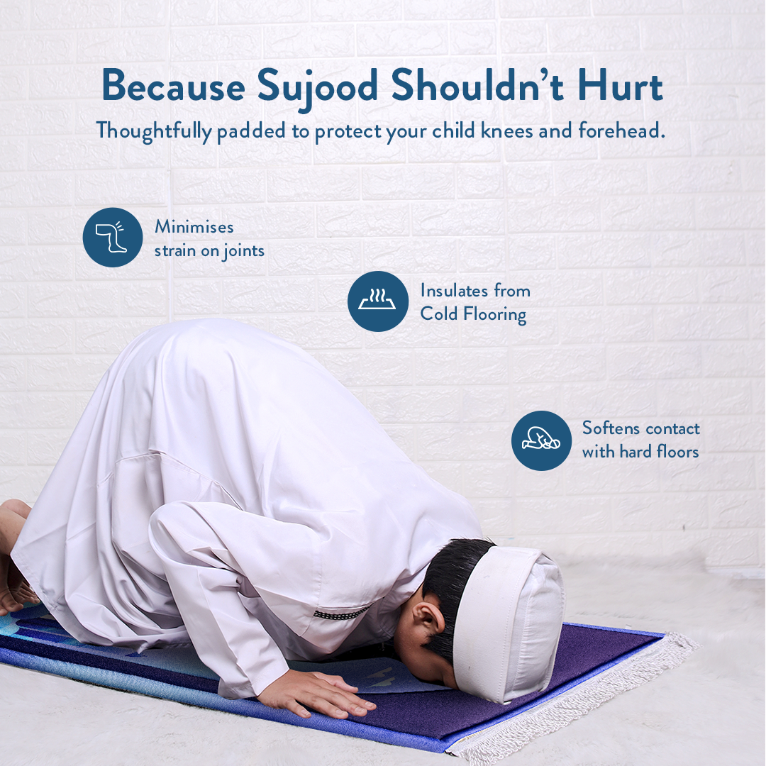 Young boy in prostration on Padded Kids Prayer Mat with Twilight Masjid Design by urban rugs uk