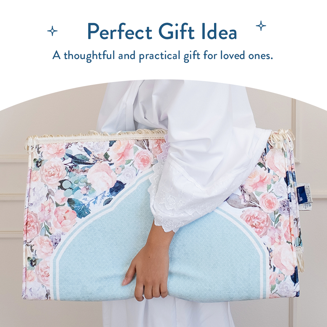 Woman holding folded adult padded prayer mat with Soft Mint Floral design from Urban Rugs UK