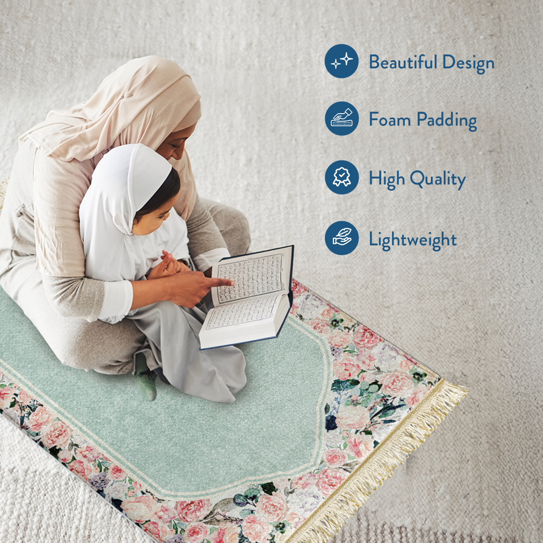 mother and daughter reading Qur’an on padded prayer mat with Soft Mint Floral design