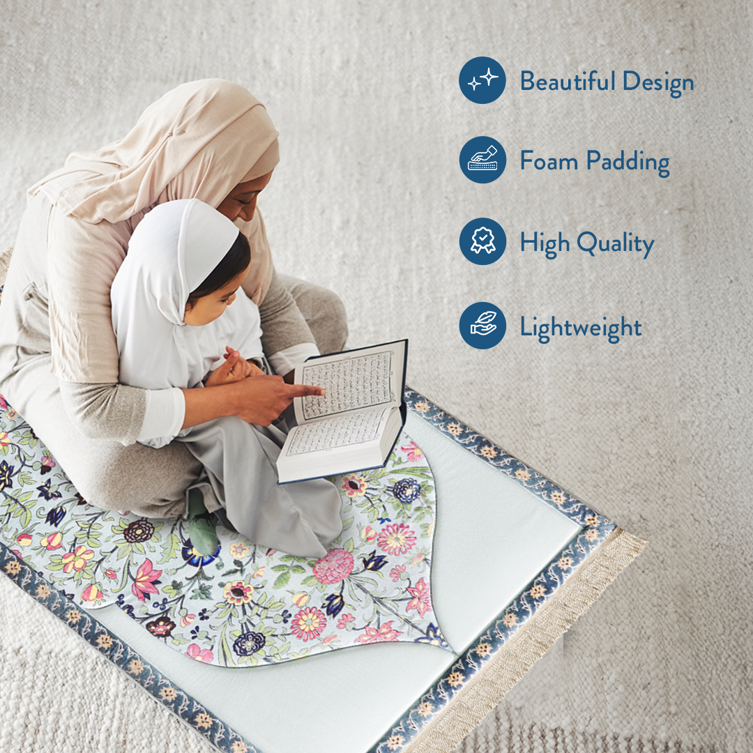 mother and daughter reading Qur’an on padded prayer mat with Spring Blossom design by Urban Rugs UK