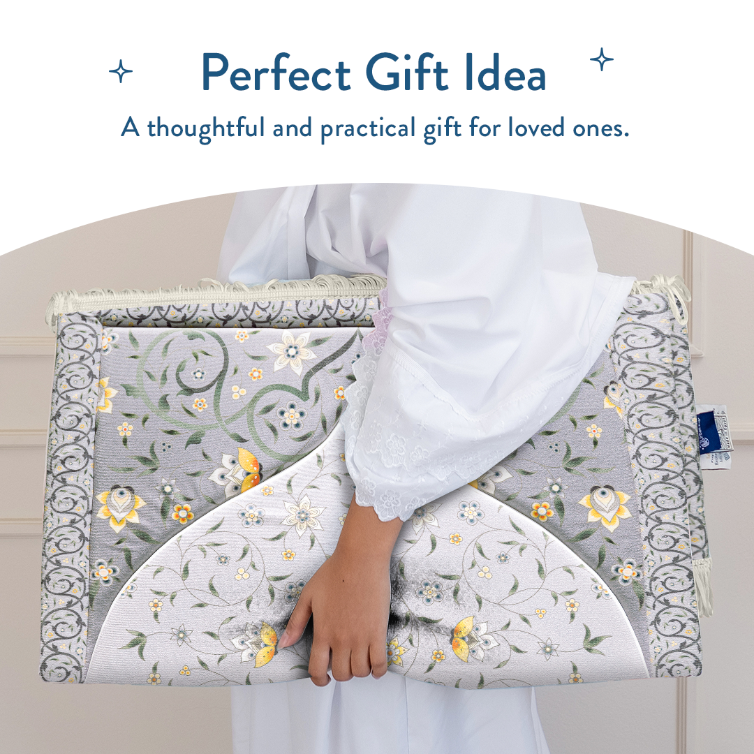 Woman holding adult padded prayer mat with yellow floral vine design from Urban Rugs UK