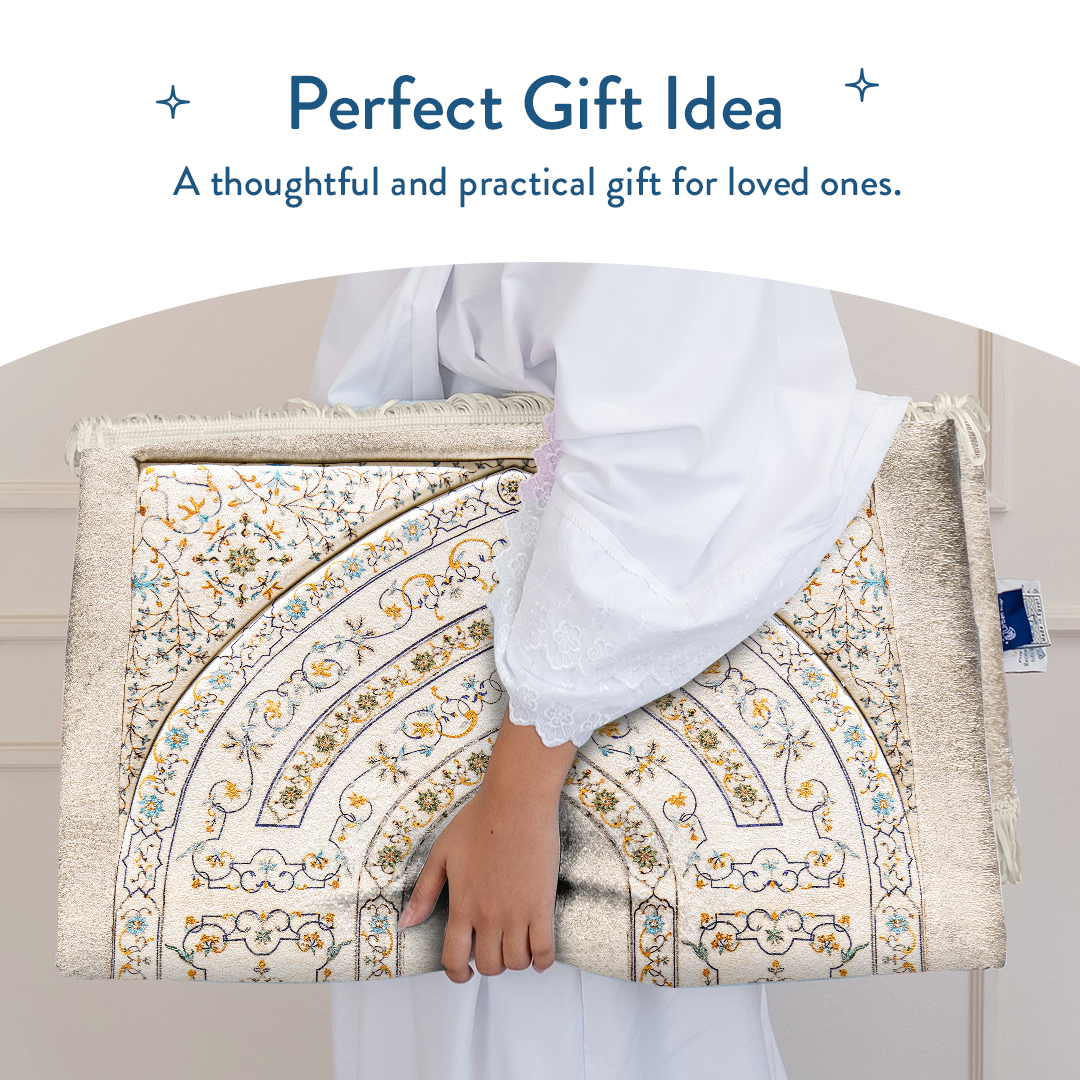 Person holding padded prayer mat with antique Indian arch design by urban Rugs UK