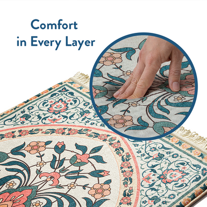 Close-up of hand pressing into padded adult prayer mat with teal and coral floral design by urban rugs uk