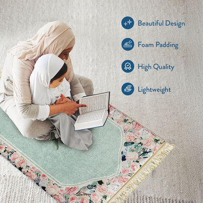 mother and daughter reading Qur’an on padded prayer mat with Soft Mint Floral design