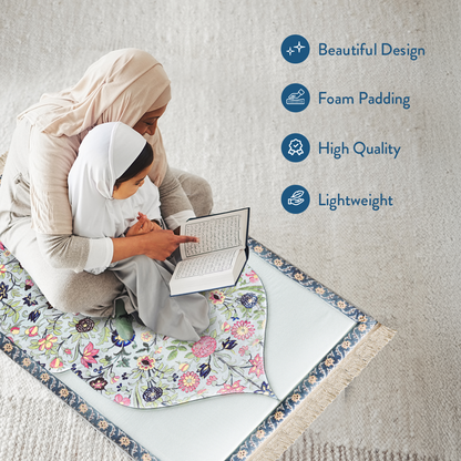 mother and daughter reading Qur’an on padded prayer mat with Spring Blossom design by Urban Rugs UK